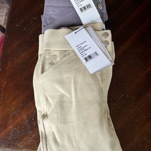 Kids Leggings in tan, grey, black and maroon.